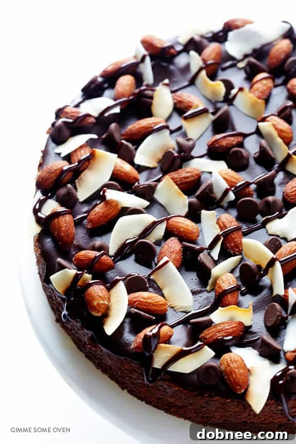 Close-up of the finished Almond Joy Cheesecake with all its beautiful toppings.