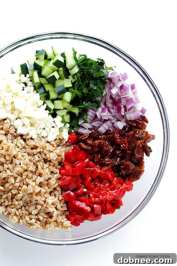 Close-up of Mediterranean Farro Salad with feta, cucumber, and sun-dried tomatoes