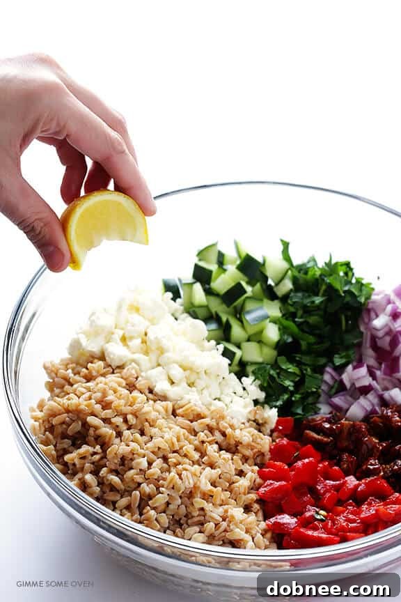 Overhead shot of freshly prepared Mediterranean Farro Salad in a serving bowl