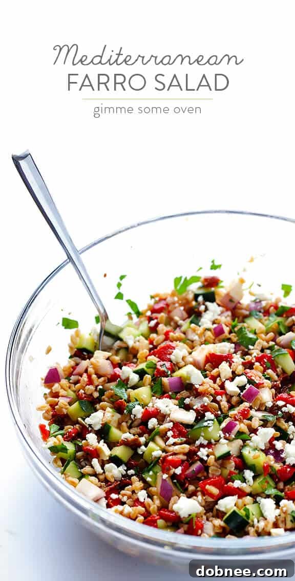 Large bowl of Mediterranean Farro Salad, garnished and ready for serving