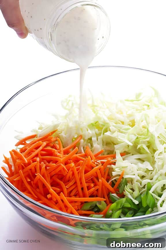 Greek Yogurt Coleslaw -- the classic coleslaw we all love, lightened up with Greek yogurt instead of mayo and ready to go in 5 minutes! | dobnee.com