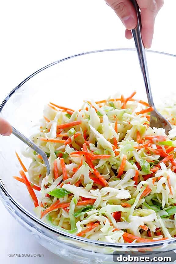 Greek Yogurt Coleslaw -- the classic coleslaw we all love, lightened up with Greek yogurt instead of mayo and ready to go in 5 minutes! | dobnee.com
