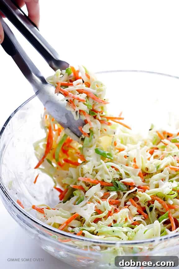 Greek Yogurt Coleslaw -- the classic coleslaw we all love, lightened up with Greek yogurt instead of mayo and ready to go in 5 minutes! | dobnee.com