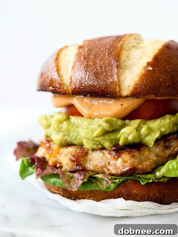 Bacon Cheddar Chicken Burgers with Guacamole and BBQ Mayo from FoodieCrush