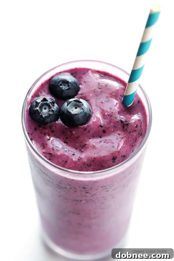 Blueberry Muffin Smoothie topped with fresh blueberries.