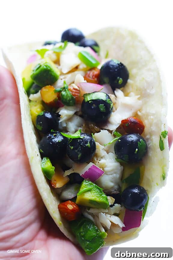 Fish Tacos with Blueberry-Almond Salsa -- perfectly sweet and savory, naturally gluten-free, and SO GOOD! | gimmesomeoven.com
