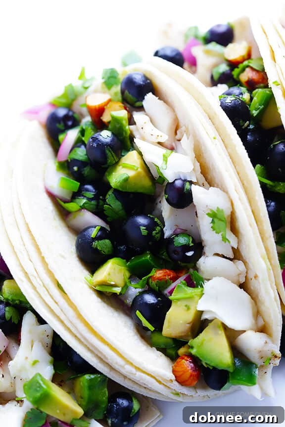 Fish Tacos with Blueberry-Almond Salsa -- perfectly sweet and savory, naturally gluten-free, and SO GOOD! | gimmesomeoven.com