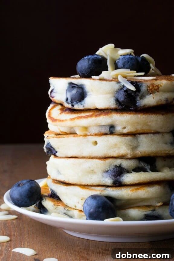 Fluffy Blueberry Almond Pancakes with syrup