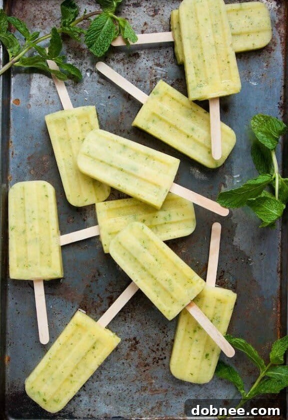 15 Stunning Summer Popsicle Treats 12 Cool Pineapple Mint Popsicles from The Corner Kitchen, a tropical and refreshing treat.