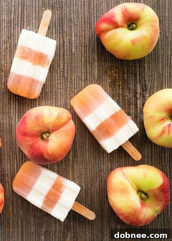 15 Stunning Summer Popsicle Treats 7 Sweet Peaches and Cream Pops by Sugar & Cloth, a classic summer flavor combination.
