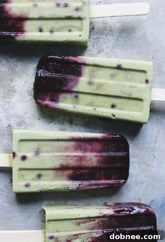 15 Stunning Summer Popsicle Treats 10 Roasted Blueberries and Cream Matcha Popsicles by With Food and Love, a fusion of flavors.