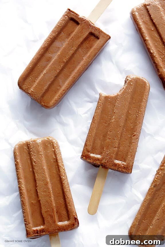 15 Stunning Summer Popsicle Treats 6 Rich 6-Ingredient Chocolate Peanut Butter Fudge Pops from Gimme Some Oven, an easy and satisfying dessert.