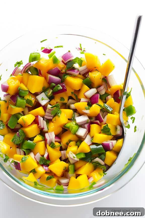 Shrimp cooking in a pan with taco seasoning.