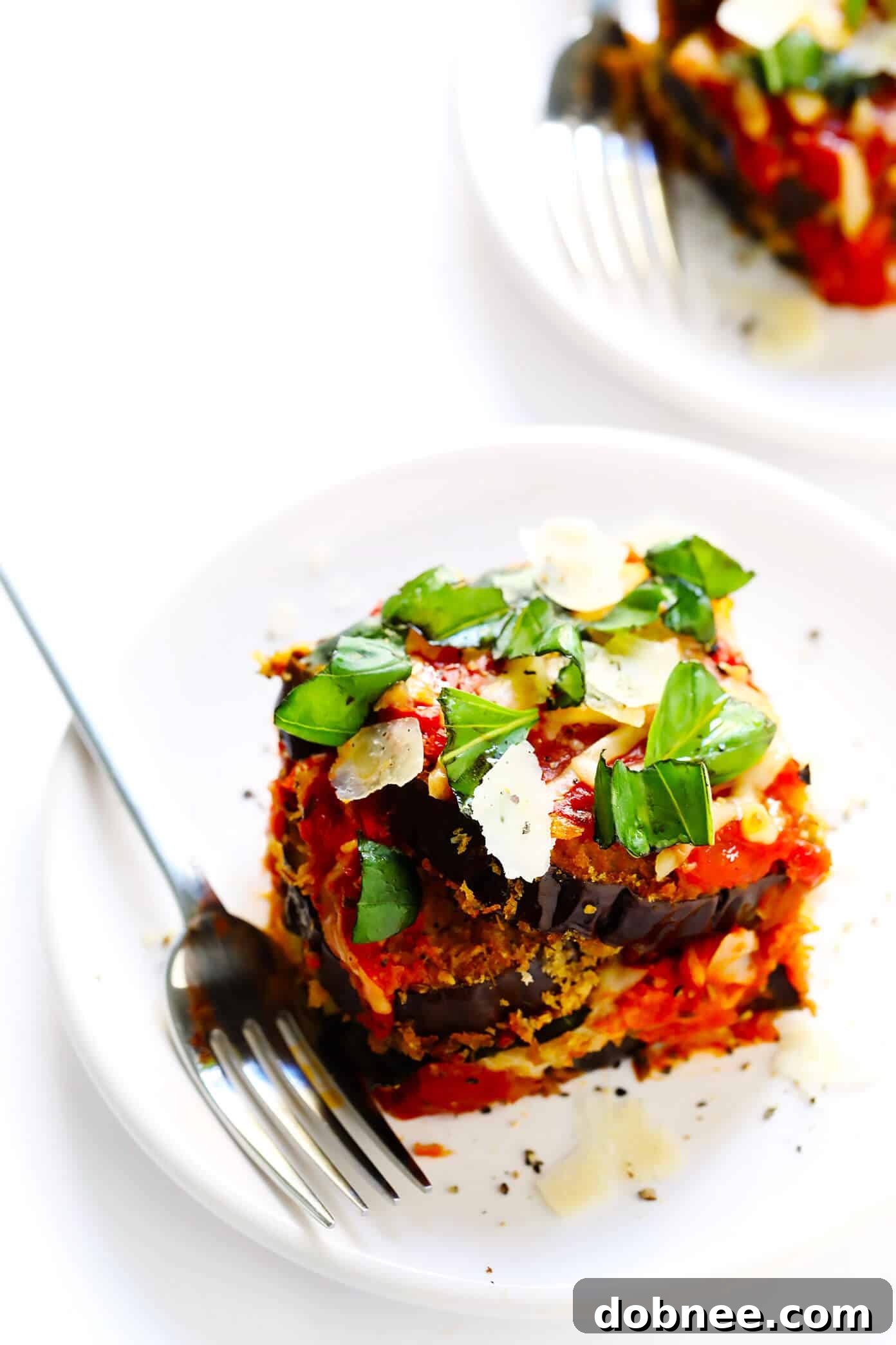 A final shot of Baked Eggplant Parmesan, generously topped with fresh basil leaves