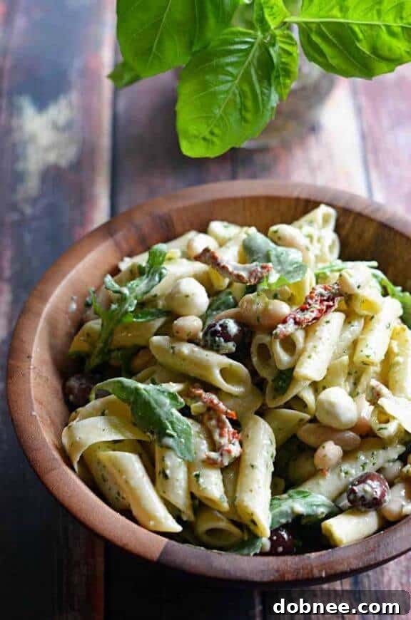 Creamy Pesto Pasta Salad by Host the Toast, a rich and flavorful pasta dish