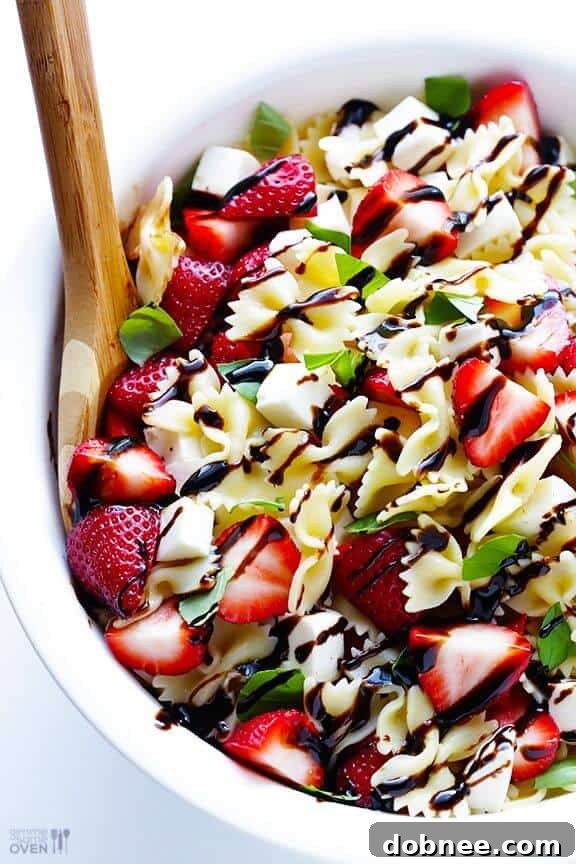 5-Ingredient Strawberry Caprese Pasta Salad from Gimme Some Oven, a unique sweet and savory blend