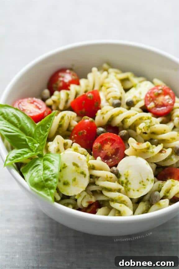 Caprese Pasta Salad recipe from Love & Olive Oil, with fresh tomatoes, mozzarella, and basil