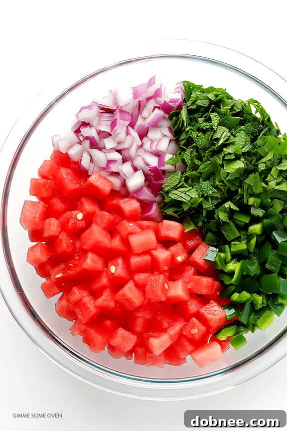 Diced watermelon, mint, cilantro, red onion, and jalapeno for a vibrant salsa.