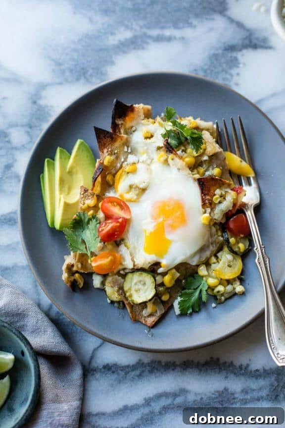 Baked Green Chilaquiles with Sweet Corn and Summer Squash, a fresh and savory vegetarian Mexican breakfast or dinner.