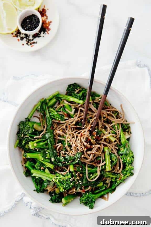 A refreshing Rapini Noodle Bowl, offering a light yet satisfying vegetarian meal packed with greens and savory flavors.