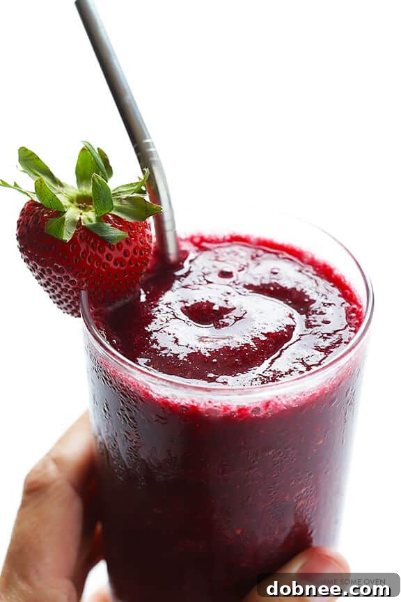 Ready-to-serve Frozen Sangria in a glass with fruit garnish