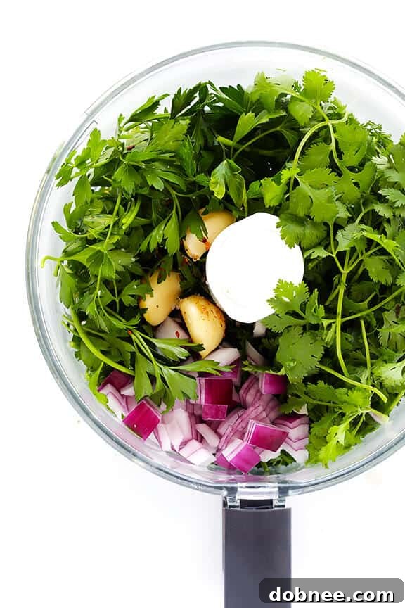 Fresh Chimichurri Shrimp plated beautifully, showcasing the vibrant green sauce and perfectly cooked pink shrimp.