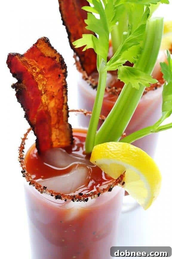 Peppered Bacon Bloody Mary - a spicy and savory cocktail with crispy bacon garnish.