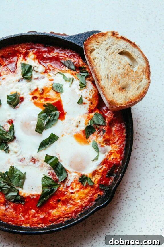 Cast Iron Baked Eggs in Tomato Sauce (Shakshuka) - a comforting and flavorful breakfast or brunch dish.