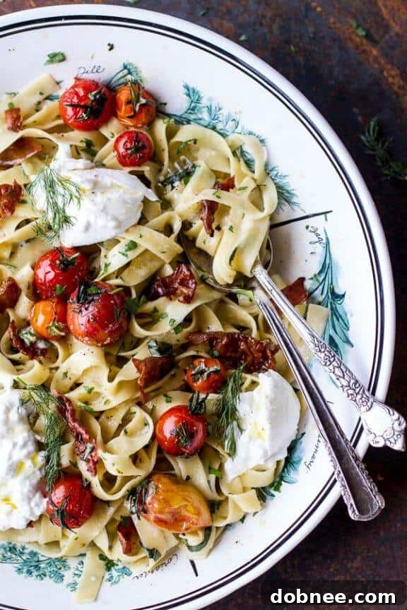 Garlic and Herb Roasted Cherry Tomato Carbonara with Crispy Prosciutto and Burrata - a gourmet pasta dish.