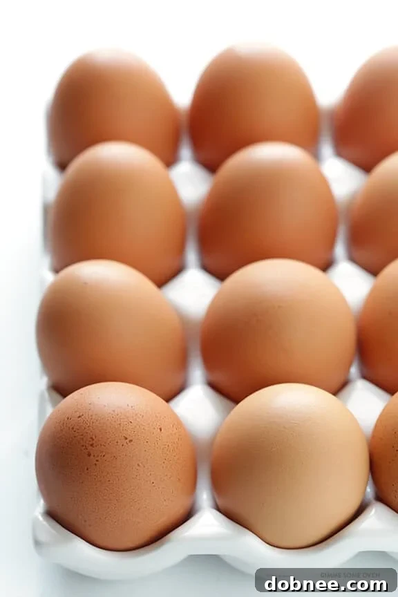 A close-up shot of perfectly cooked hard-boiled eggs, showcasing their smooth texture and inviting appearance, ready to be peeled. This image highlights the quality achievable with the right method for making perfect hard-boiled eggs.