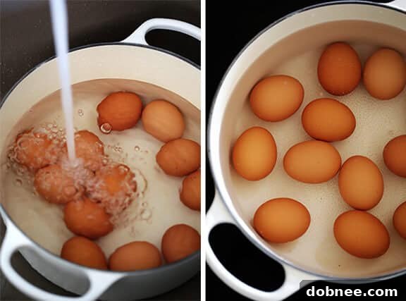 Three hard-boiled eggs in their shells, ready for cooking. This visual emphasizes the starting point for creating perfect hard-boiled eggs.