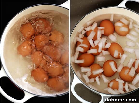 Water boiling vigorously in a saucepan with eggs, illustrating the initial crucial step in making perfect hard-boiled eggs.