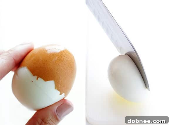 Hard-boiled eggs submerged in an ice bath, demonstrating the crucial chilling step for easy peeling and perfect texture.