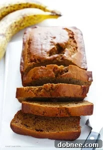 The ultimate moist and healthy banana bread recipe, naturally sweetened with maple syrup and made with white whole wheat flour.