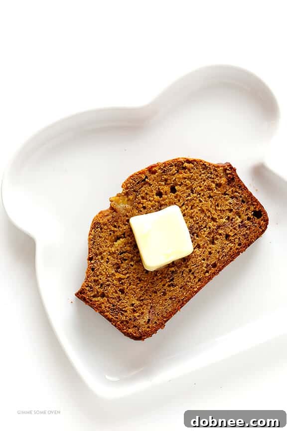 A close-up of a slice of moist banana bread, showing its tender crumb and rich flavor.