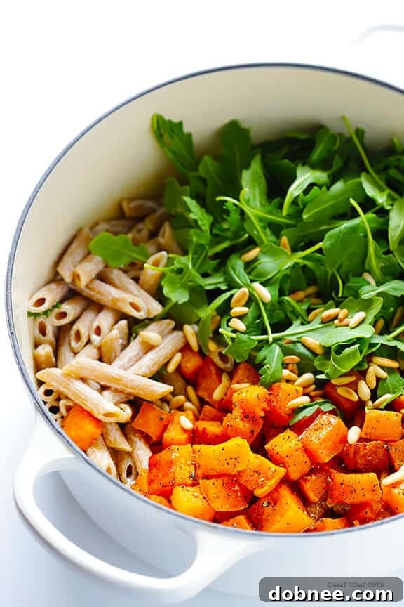 Roasted butternut squash on a baking sheet for pasta recipe | gimmesomeoven.com