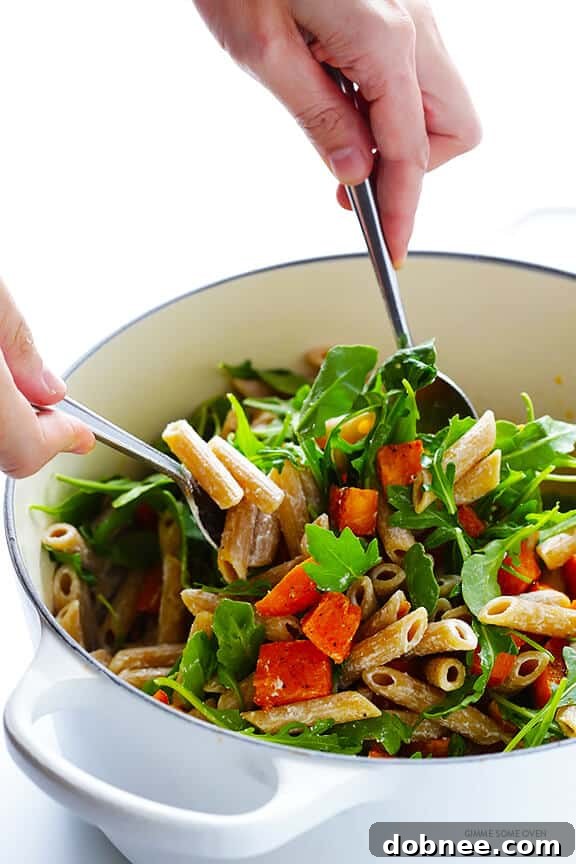 Mixing the 5-Ingredient Butternut Squash, Arugula and Goat Cheese Pasta with fresh ingredients | gimmesomeoven.com