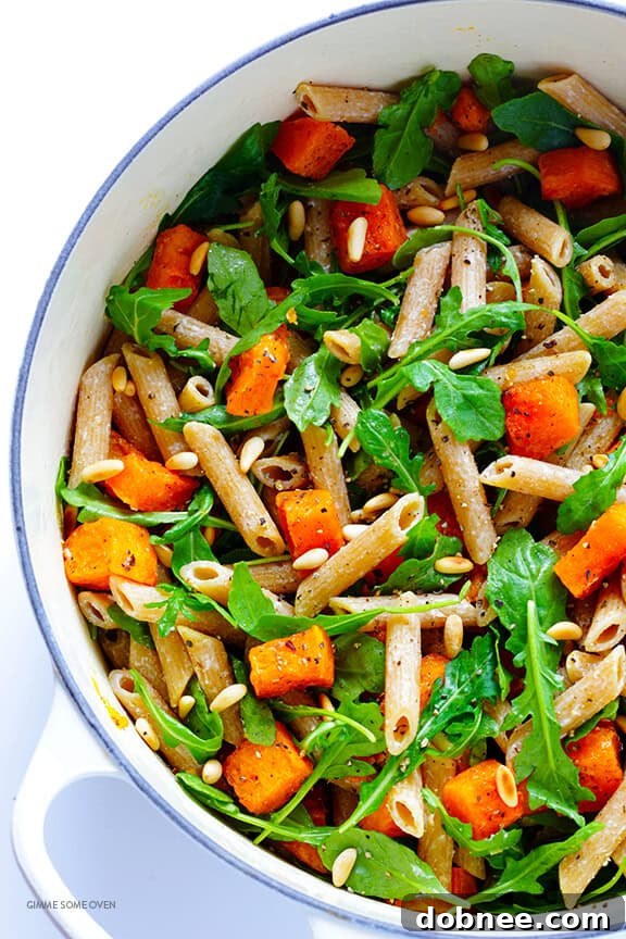 Final toss of 5-Ingredient Butternut Squash, Arugula and Goat Cheese Pasta with black pepper | gimmesomeoven.com