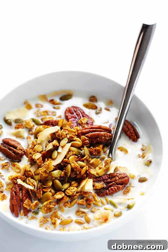 Pumpkin Spice Granola served with milk and berries for breakfast