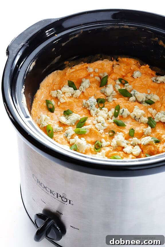 Slow Cooker Buffalo Chicken Dip – the irresistible appetizer we all love, made extra easy in the crock pot! | gimmesomeoven.com