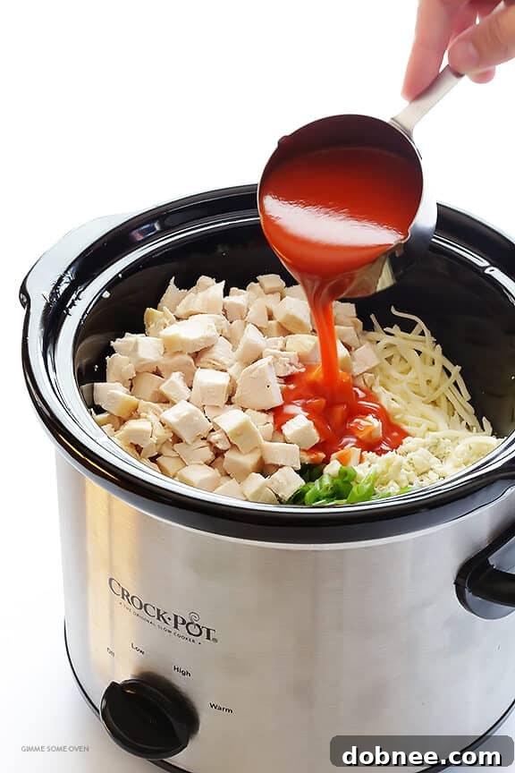 Slow Cooker Buffalo Chicken Dip – the irresistible appetizer we all love, made extra easy in the crock pot! | gimmesomeoven.com