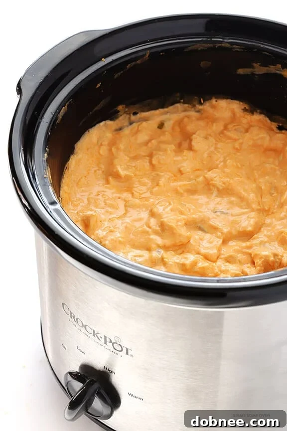 Slow Cooker Buffalo Chicken Dip – the irresistible appetizer we all love, made extra easy in the crock pot! | gimmesomeoven.com
