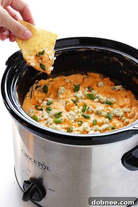 Slow Cooker Buffalo Chicken Dip – the irresistible appetizer we all love, made extra easy in the crock pot! | gimmesomeoven.com