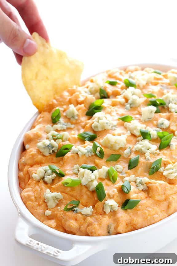 Slow Cooker Buffalo Chicken Dip – the irresistible appetizer we all love, made extra easy in the crock pot! | gimmesomeoven.com