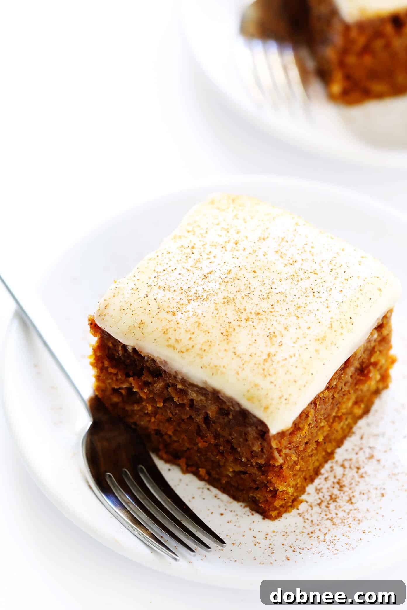 Moist Pumpkin Bars generously topped with Cream Cheese Frosting