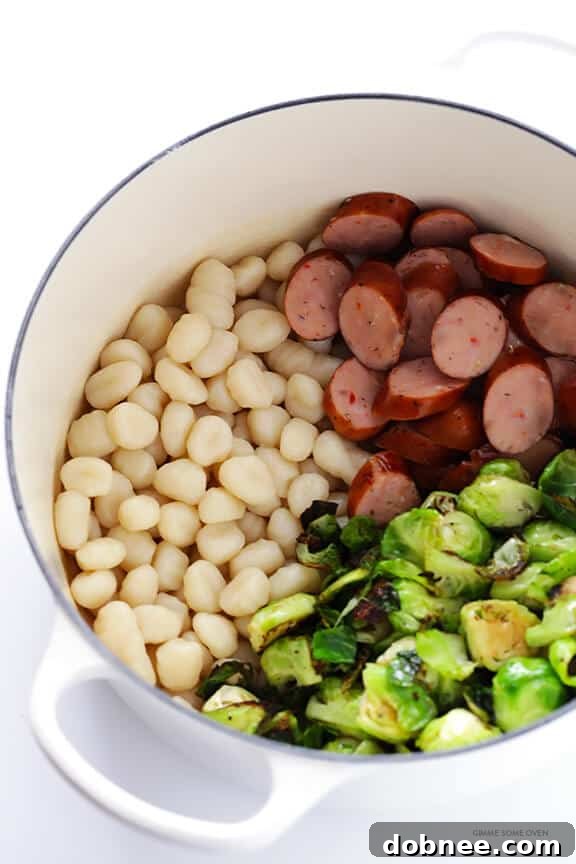 Gnocchi with Brussels Sprouts, Chicken Sausage and Kale Pesto -- quick and easy to make and SO flavorful! | dobnee.com