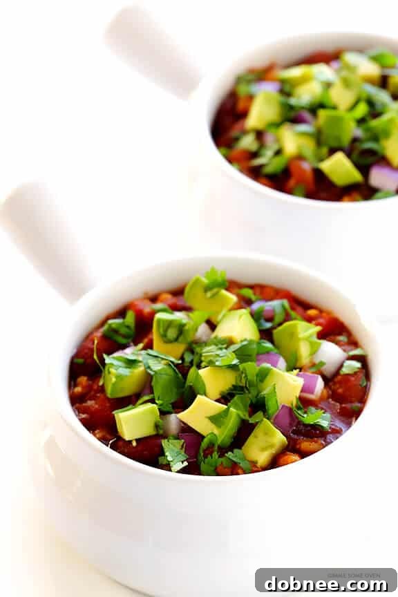 Slow Cooker Vegetarian Chili Recipe -- easy to make in the crock pot or on the stovetop, naturally gluten-free and vegan, and SO delicious! | dobnee.com
