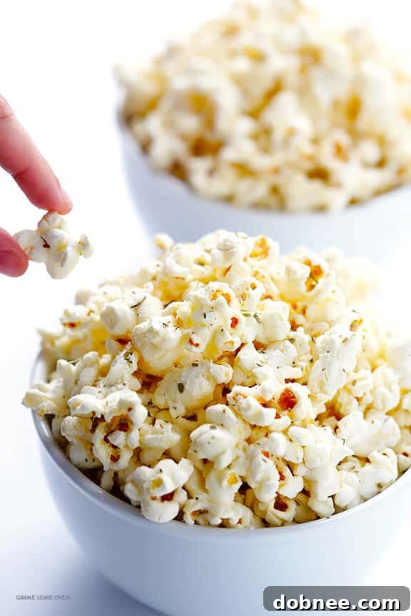 Olive Oil and Parmesan Popcorn -- easy to make with just a few ingredients, and so irresistibly good! | gimmesomeoven.com