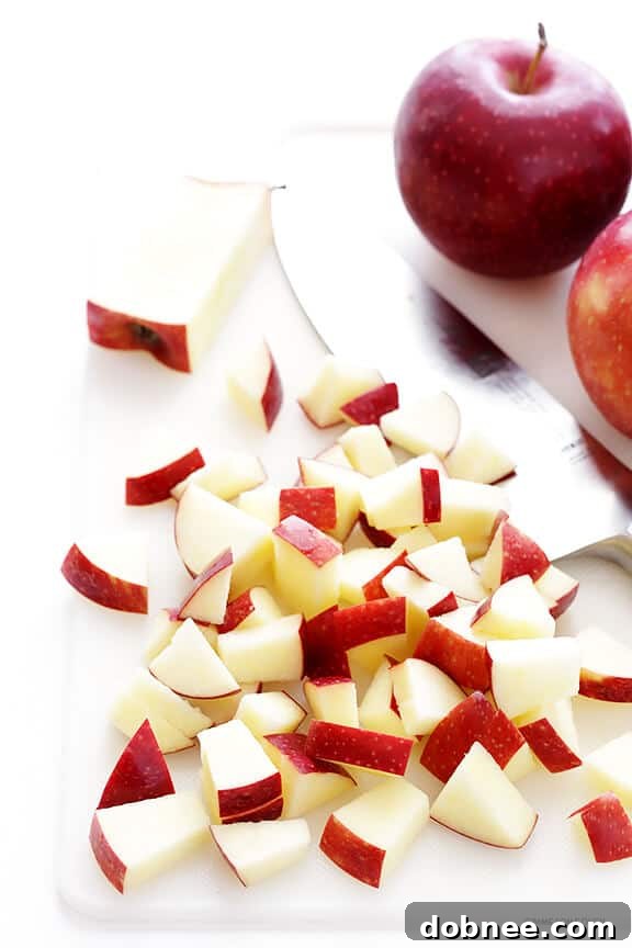 Perfectly baked apple crisp with a golden oat topping and bubbly apple filling, served warm in a baking dish.