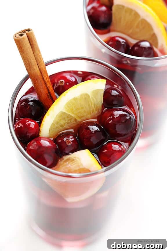 Sparkling Cranberry Orange Sangria Recipe -- quick and easy to make, and perfect for the holidays or any good party! | gimmesomeoven.com